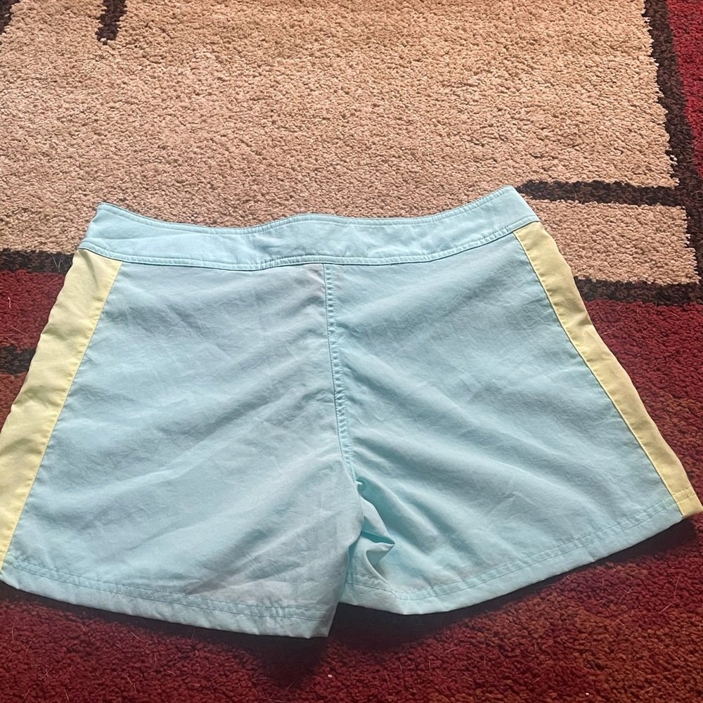 Nike running shorts blue/yellow size medium (8-10).